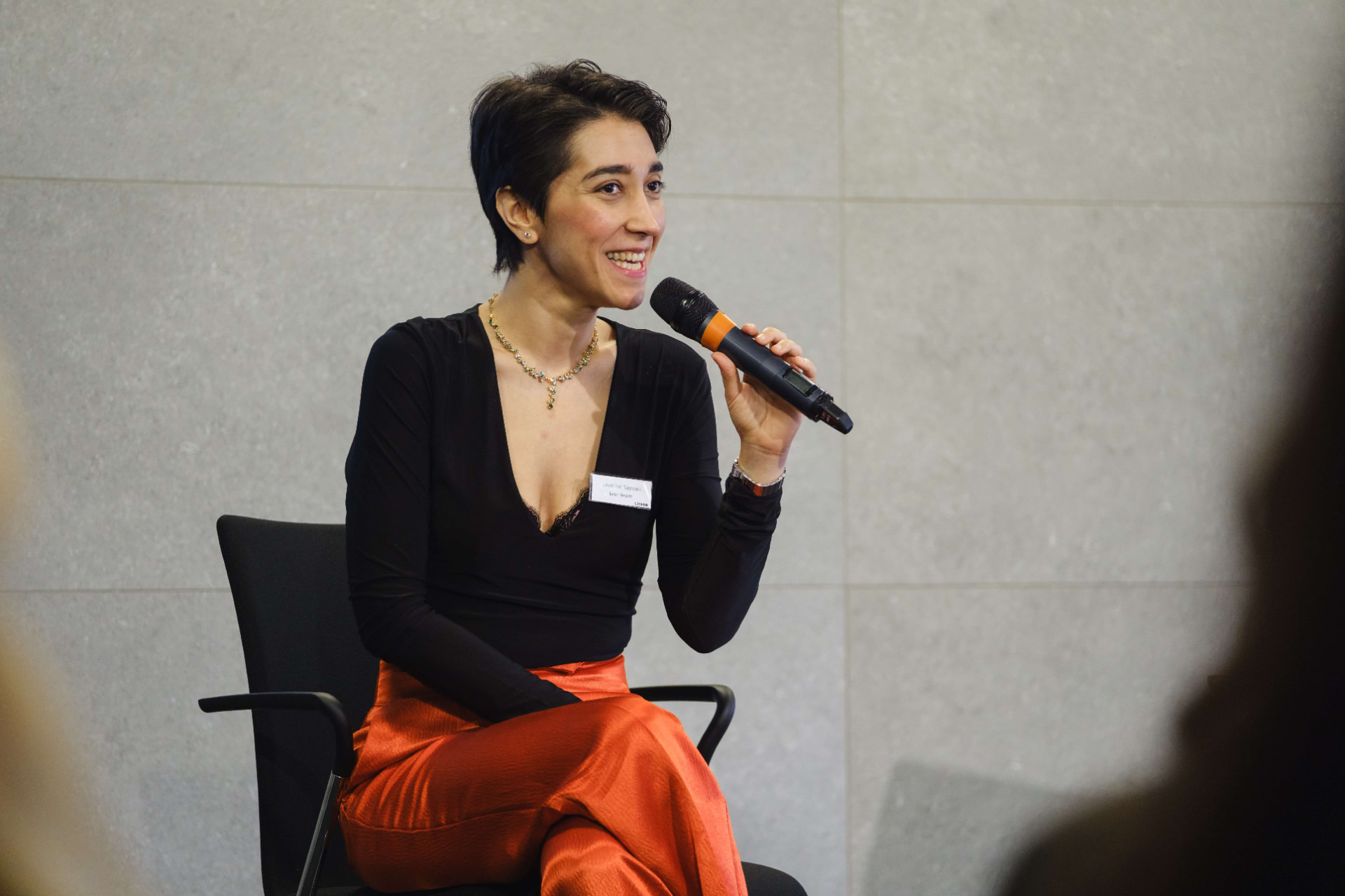 Dr Jasmine Sayyari speaking at a professional event